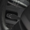 A CM35 Cruise Control Command Module neatly fitted and integrated into a vehicle's interior for convenient speed control.